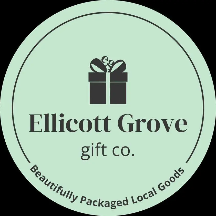 A green circle with the words ellicott grove gift co.